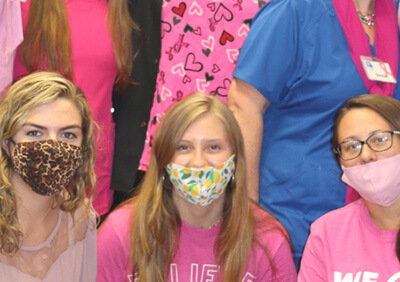 Young women wearing masks